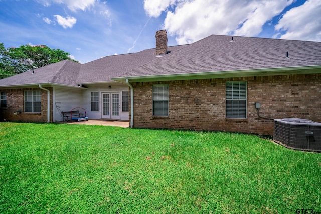 3 Casey Ct, Longview, TX 75604 - back of property featuring french doors, a chimney, roof with shingles, a yard, and brick siding
