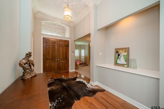 3 Casey Ct, Longview, TX 75604 - foyer with crown molding, wood finished floors, and a towering ceiling