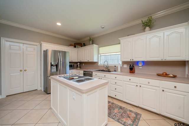 3 Casey Ct, Longview, TX 75604 - kitchen with stainless steel appliances, light tile patterned floors, white cabinetry, crown molding, and a center island