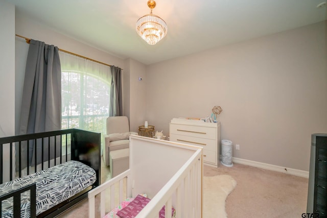 3 Casey Ct, Longview, TX 75604 - bedroom with light carpet and a chandelier