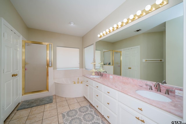3 Casey Ct, Longview, TX 75604 - bathroom with a shower stall, a garden tub, tile patterned floors, and double vanity
