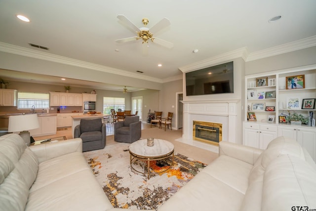 3 Casey Ct, Longview, TX 75604 - living room featuring ornamental molding, plenty of natural light, a ceiling fan, recessed lighting, and a fireplace with flush hearth