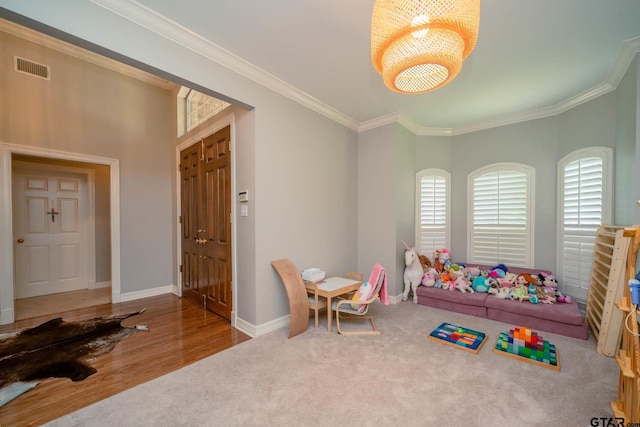 3 Casey Ct, Longview, TX 75604 - playroom with ornamental molding, a chandelier, carpet, and wood finished floors