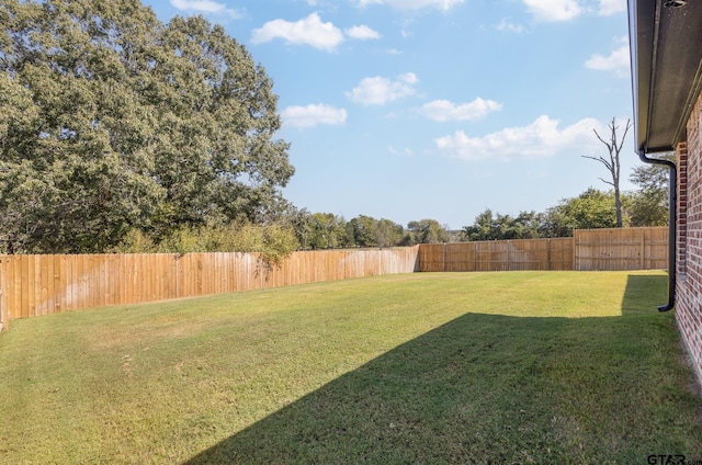 view of yard featuring a fenced backyard