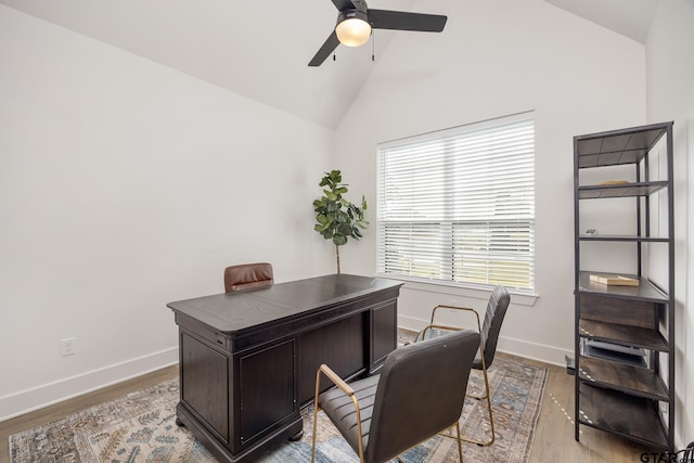 office featuring baseboards, lofted ceiling, a ceiling fan, and wood finished floors