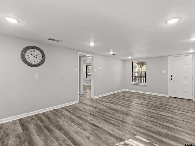 11661 Fm 852, Gilmer, TX 75644 - unfurnished living room with recessed lighting, baseboards, visible vents, and wood finished floors