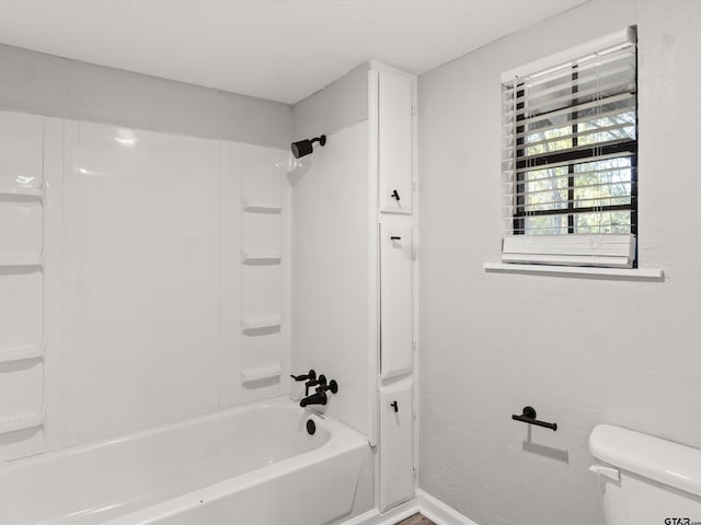 11661 Fm 852, Gilmer, TX 75644 - full bathroom featuring shower / bath combination, baseboards, and toilet