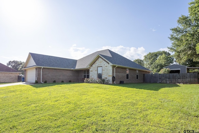 702 Jaxon Dr, Whitehouse, TX 75791 - rear view of property with an attached garage, brick siding, a shingled roof, and stone siding