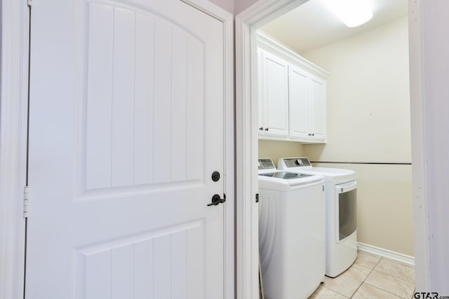 702 Jaxon Dr, Whitehouse, TX 75791 - laundry area with washer and clothes dryer, cabinet space, and light tile patterned floors