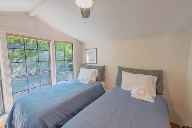 bedroom with crown molding, vaulted ceiling with beams, and ceiling fan