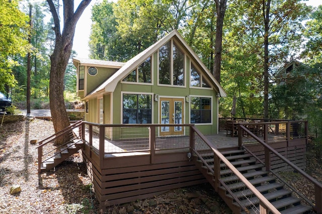 back of house with french doors and a wooden deck