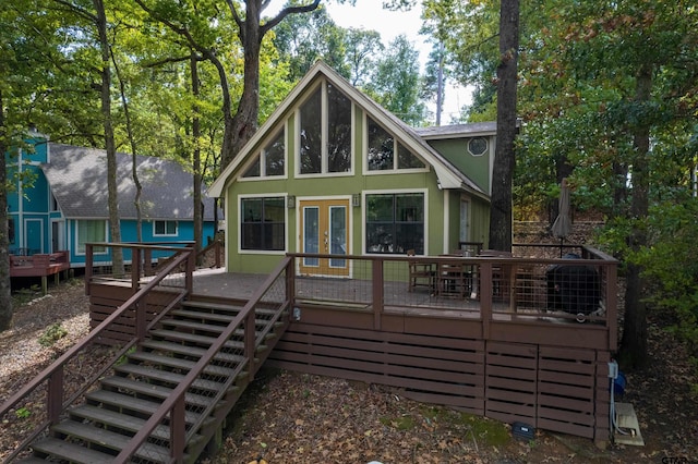 back of house featuring a wooden deck