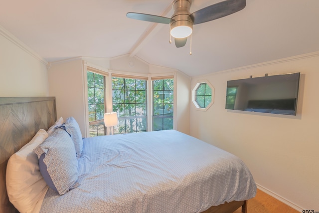 bedroom with ornamental molding, multiple windows, vaulted ceiling with beams, and ceiling fan