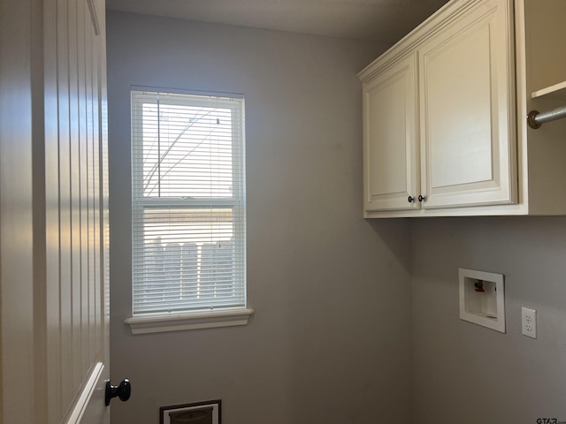 laundry area with cabinets and washer hookup