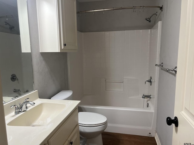 full bathroom featuring vanity, wood-type flooring, bathtub / shower combination, and toilet