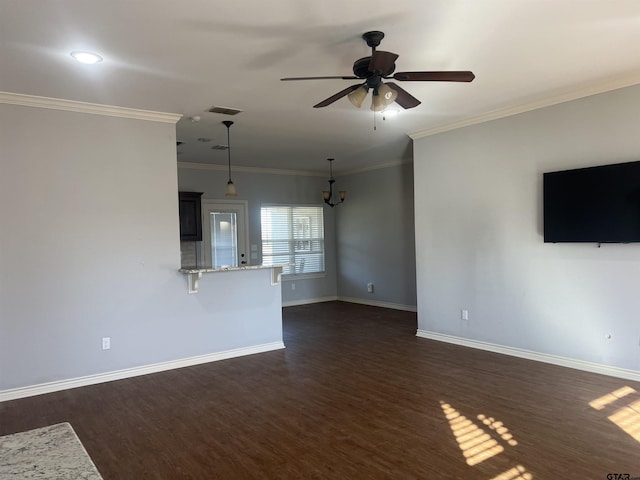 unfurnished living room with ceiling fan, dark wood-type flooring, and ornamental molding