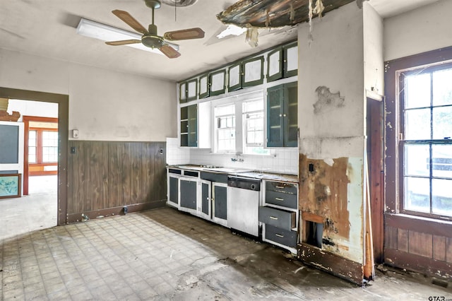 kitchen featuring dishwasher, ceiling fan, and a wealth of natural light