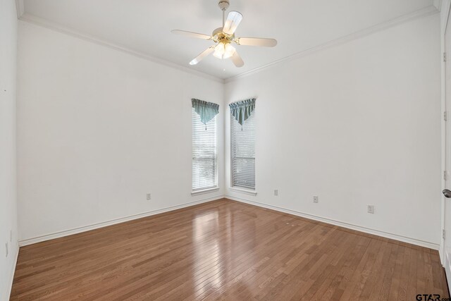 unfurnished room with ornamental molding, hardwood / wood-style floors, and ceiling fan