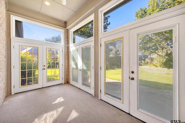 entryway with light colored carpet and french doors