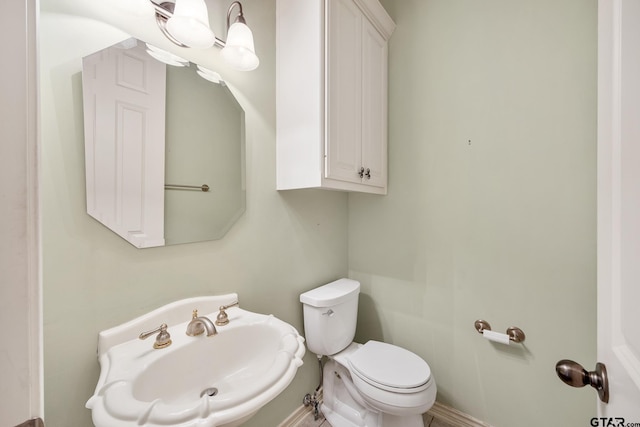 bathroom featuring sink and toilet