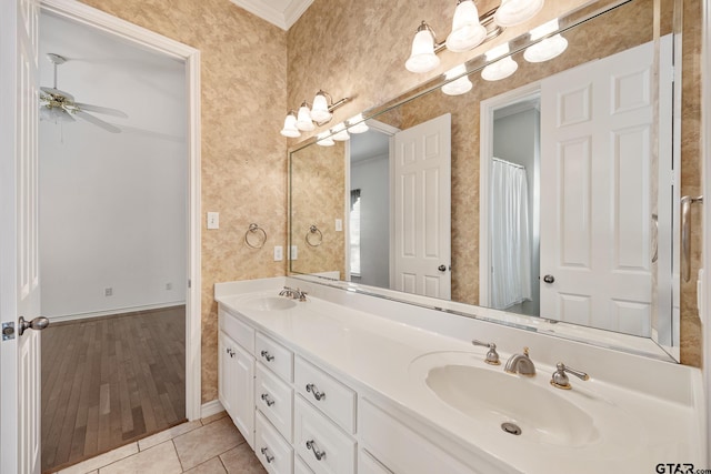 bathroom featuring hardwood / wood-style flooring, ceiling fan, vanity, and crown molding