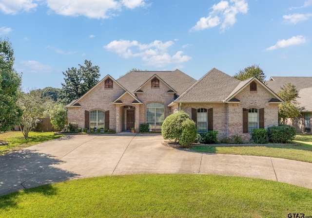 craftsman-style house with a front lawn