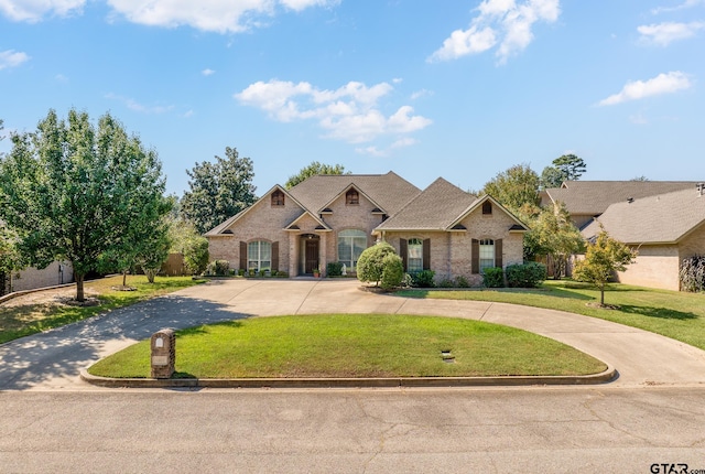 craftsman-style house with a front yard