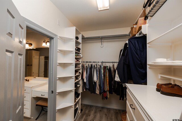 walk in closet featuring dark hardwood / wood-style floors