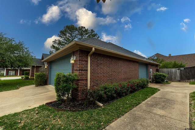 view of side of home with a garage