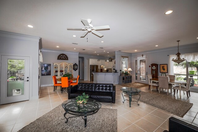 tiled living room featuring ceiling fan, ornamental molding, and a healthy amount of sunlight