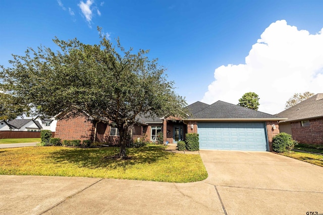 view of front of house with a garage and a front yard