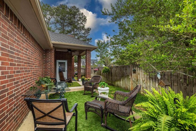 view of patio featuring ceiling fan