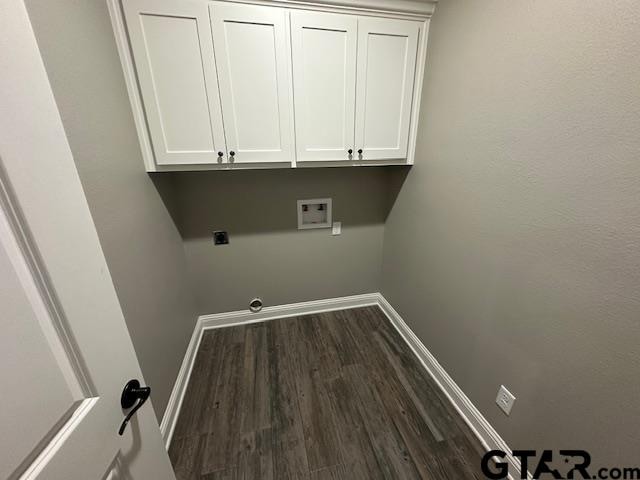 clothes washing area with cabinets, washer hookup, dark hardwood / wood-style floors, and hookup for an electric dryer