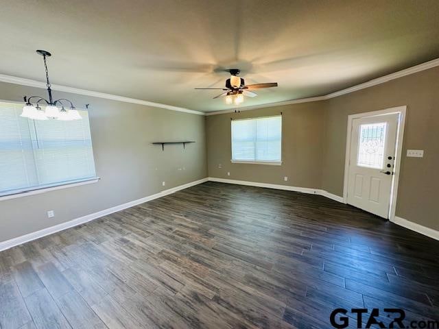 spare room featuring ceiling fan, dark hardwood / wood-style floors, and crown molding