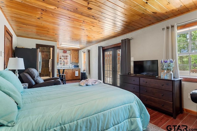 5766 Fm 279, Ben Wheeler, TX 75754 - bedroom featuring wooden ceiling, wood finished floors, freestanding refrigerator, crown molding, and french doors