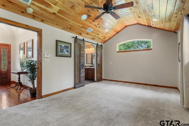5766 Fm 279, Ben Wheeler, TX 75754 - carpeted empty room featuring a barn door, wood ceiling, ceiling fan, lofted ceiling, and a smoke detector