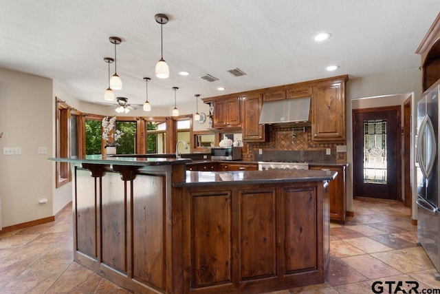 5766 Fm 279, Ben Wheeler, TX 75754 - kitchen featuring extractor fan, stainless steel appliances, backsplash, ceiling fan, and recessed lighting