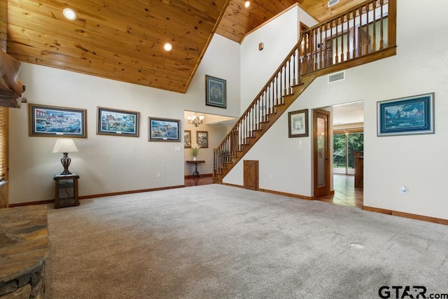 5766 Fm 279, Ben Wheeler, TX 75754 - unfurnished living room featuring wooden ceiling, stairway, carpet floors, high vaulted ceiling, and a chandelier
