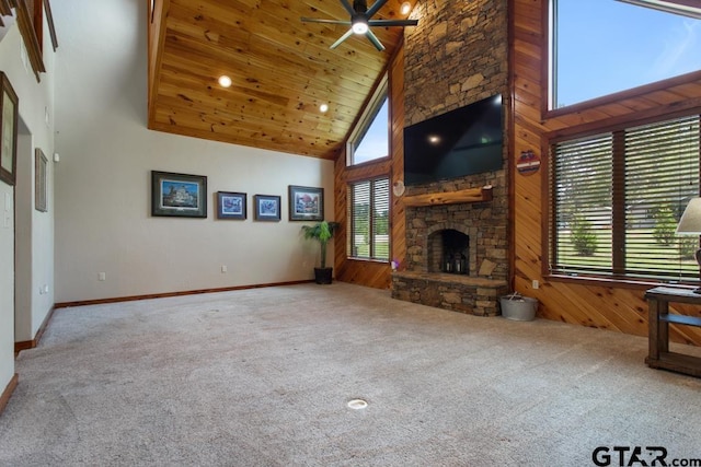 5766 Fm 279, Ben Wheeler, TX 75754 - unfurnished living room with plenty of natural light, high vaulted ceiling, carpet floors, a ceiling fan, and a fireplace