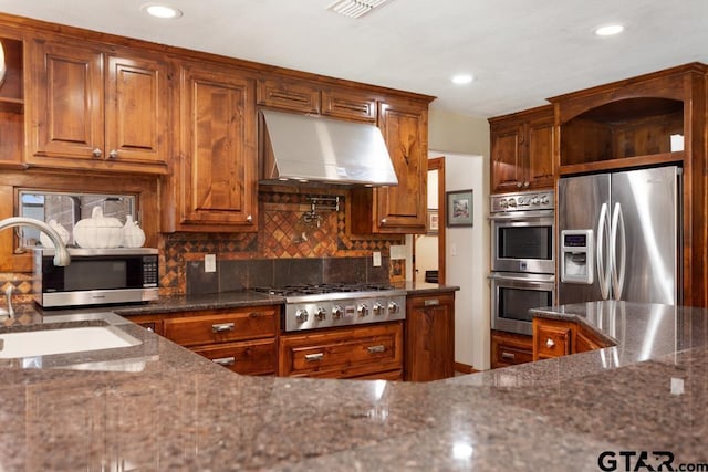 5766 Fm 279, Ben Wheeler, TX 75754 - kitchen with appliances with stainless steel finishes, open shelves, range hood, dark stone counters, and recessed lighting