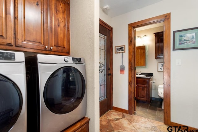 5766 Fm 279, Ben Wheeler, TX 75754 - laundry room with washer and dryer, cabinet space, and light stone finish flooring