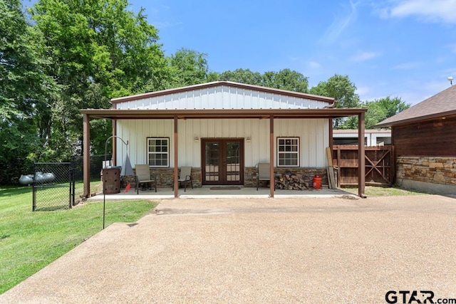 5766 Fm 279, Ben Wheeler, TX 75754 - back of house with french doors, board and batten siding, and a gate