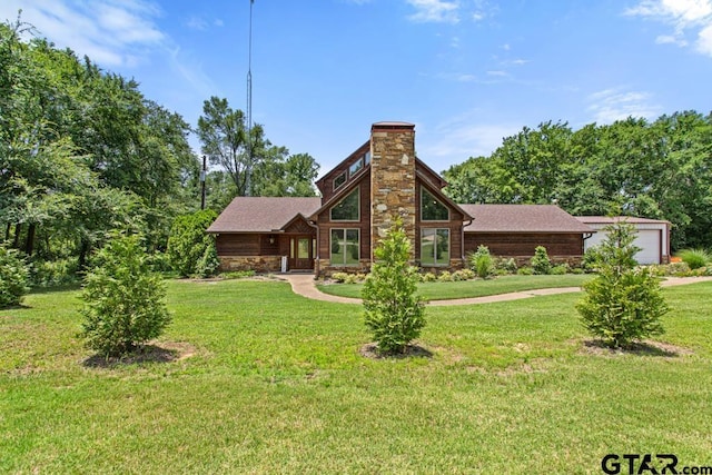 5766 Fm 279, Ben Wheeler, TX 75754 - mid-century modern home with a chimney, a front lawn, a garage, and roof with shingles