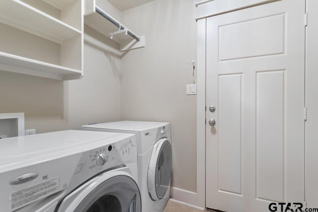 6023 Grace Ave, Tyler, TX 75707 - laundry room featuring washer and clothes dryer and baseboards