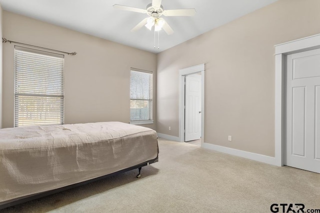 6023 Grace Ave, Tyler, TX 75707 - bedroom featuring light carpet and ceiling fan