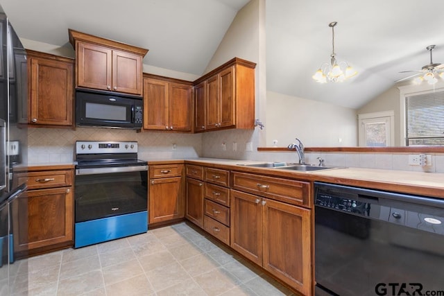 kitchen featuring sink, backsplash, lofted ceiling, and black appliances