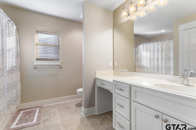 bathroom with vanity, a shower with shower curtain, and toilet