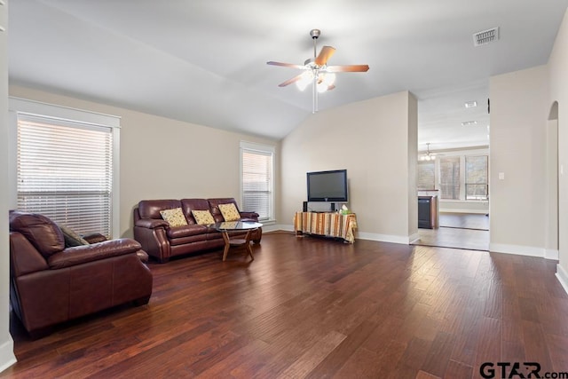 living room featuring dark hardwood / wood-style flooring, plenty of natural light, ceiling fan, and lofted ceiling