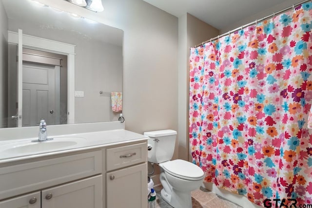 6023 Grace Ave, Tyler, TX 75707 - bathroom featuring vanity, toilet, tile patterned flooring, and curtained shower