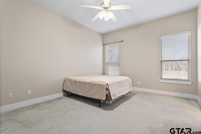 living room featuring hardwood / wood-style floors, ceiling fan with notable chandelier, and lofted ceiling